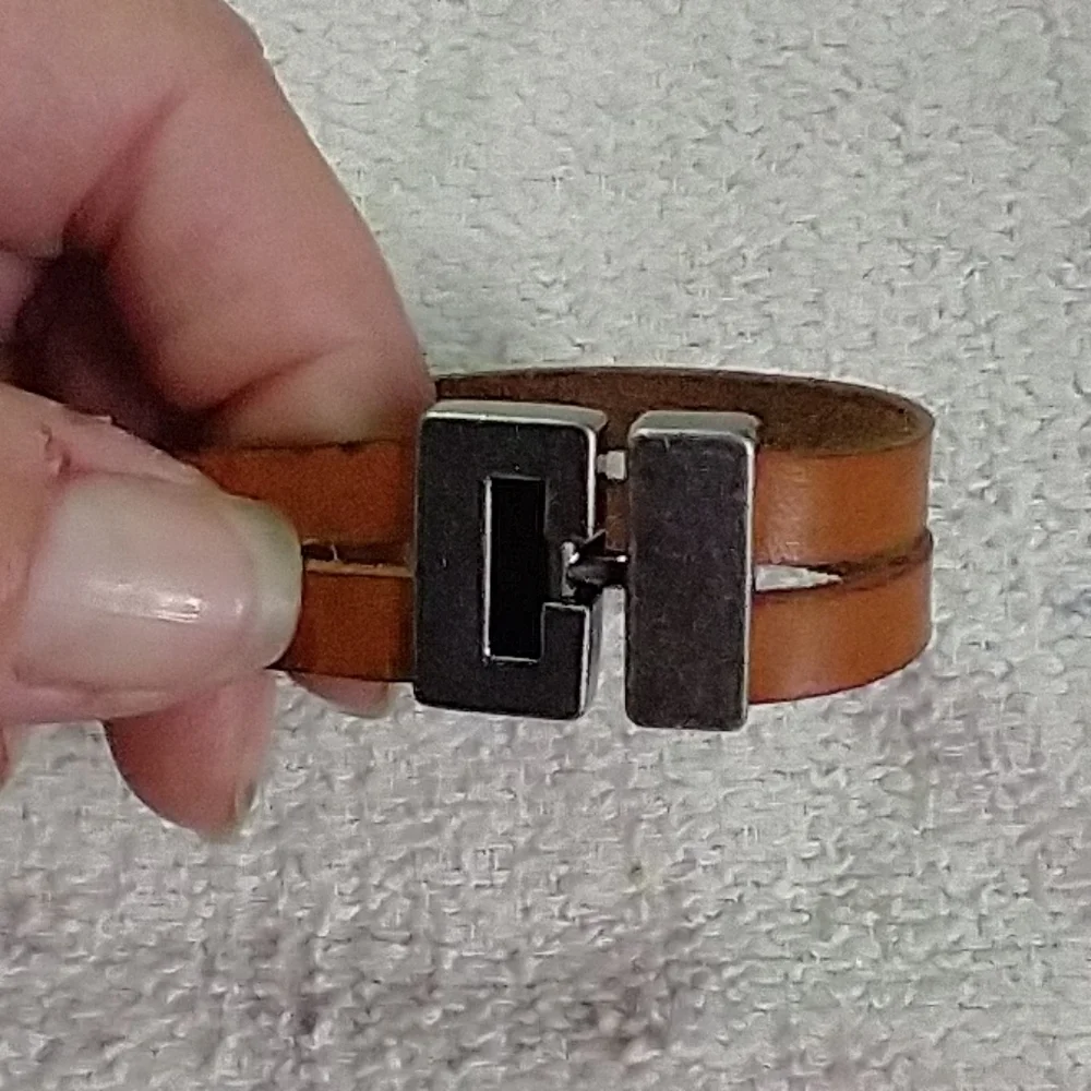 Silvertone faux amber brown leather bracelet